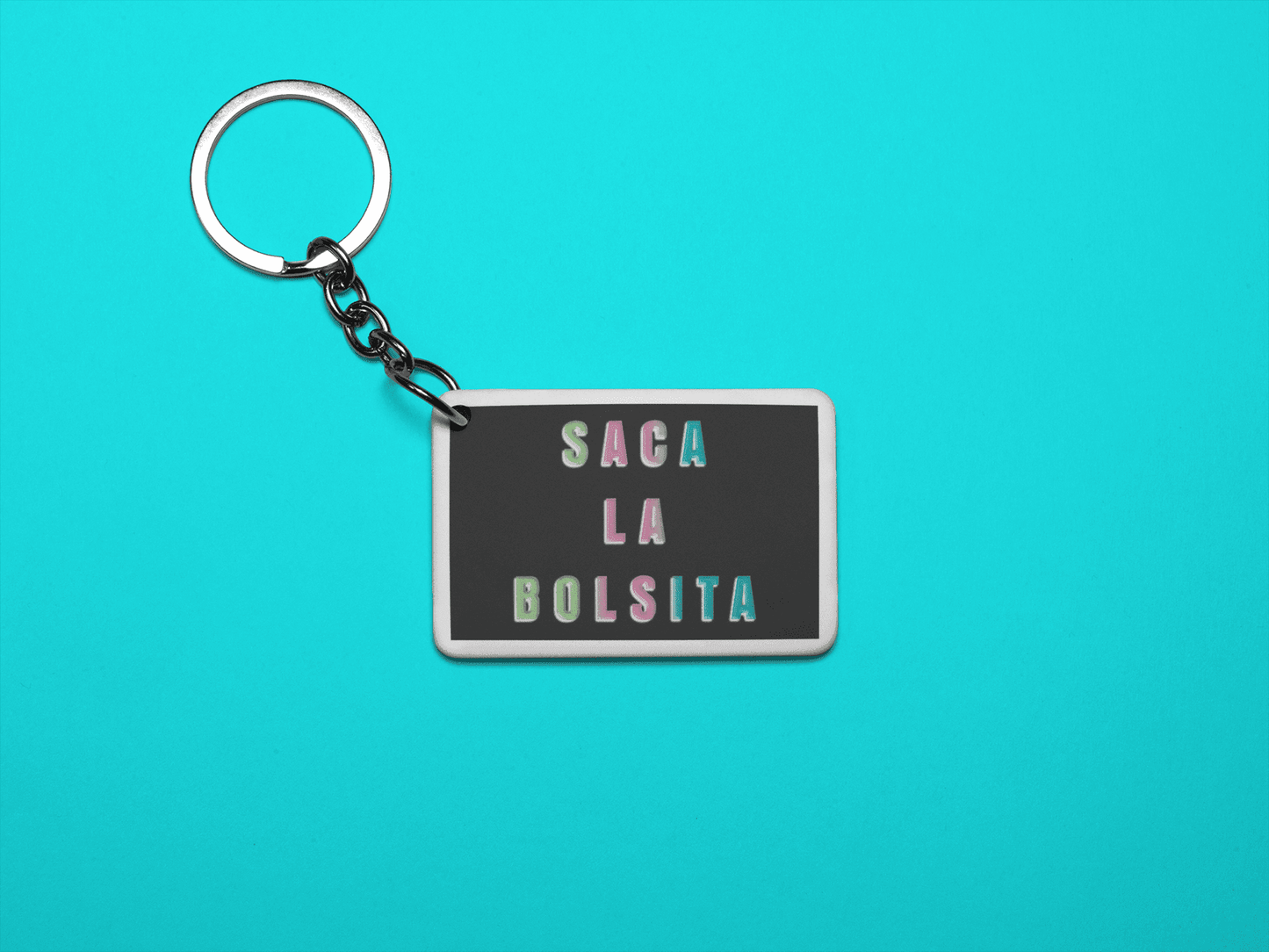 Saca La Bolsita Graphic Keychain - 3 x 2 inches - Gacho Bad Designs